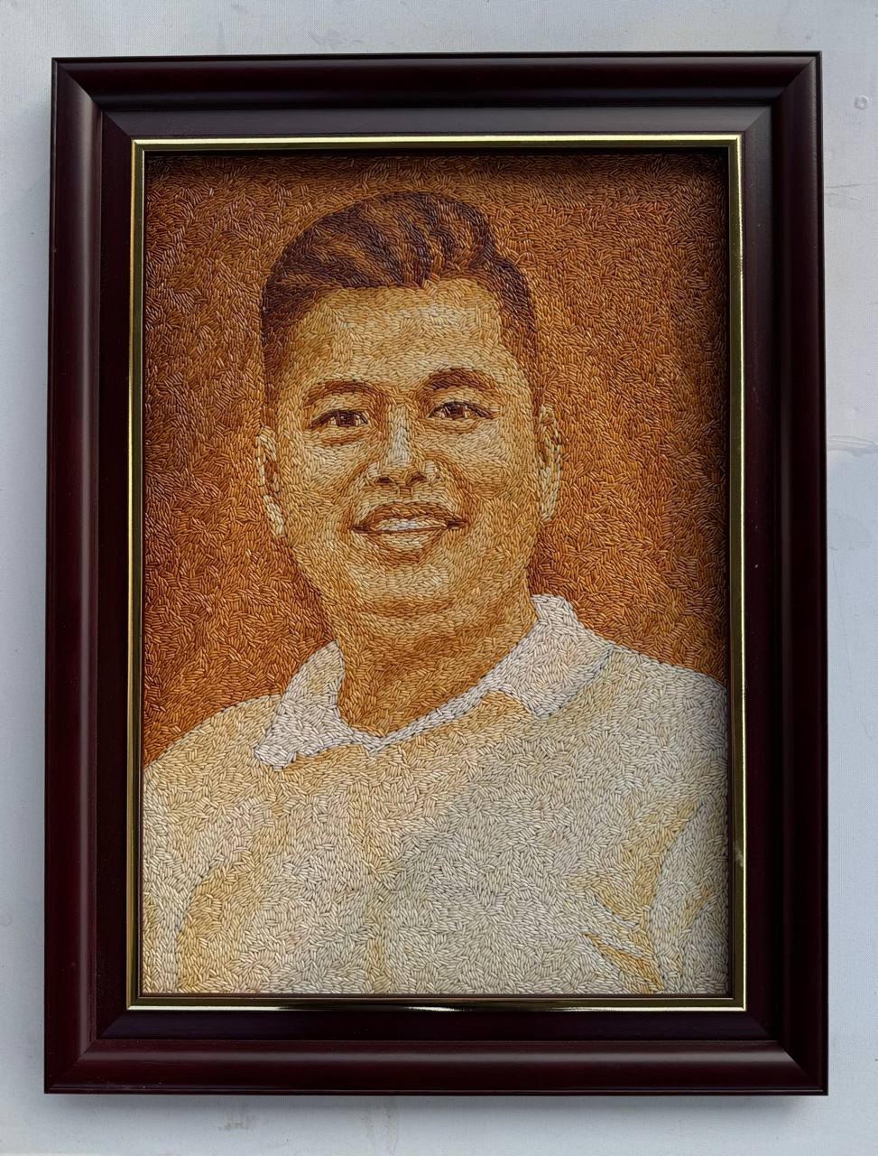 Tranh gạo nghệ thuật ch&acirc;n dung l&atilde;nh đạo